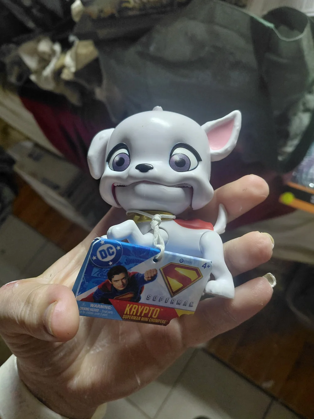 DC Comics Krypto the Superdog mini toy figure with a tag attached.